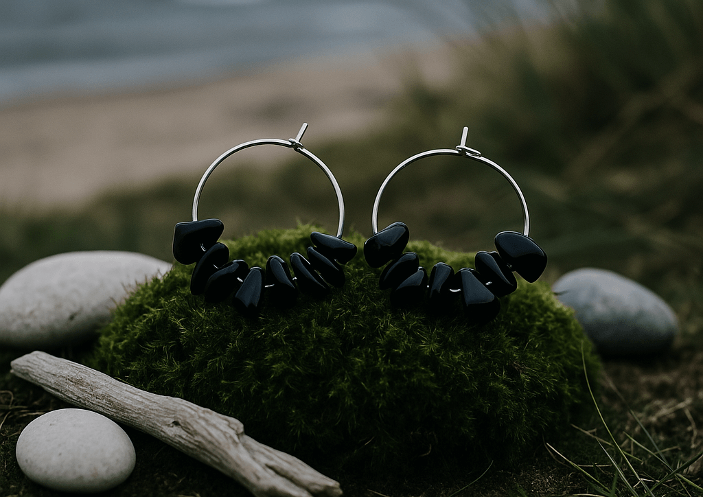 About Us - Smoky Quartz Hoop Earrings Silver placed on a lush bed of green moss.